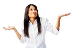 Woman shrugging her shoulders with a confused expression, representing uncertainty about how to start studying early and work smart.