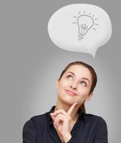 Woman with a thought bubble containing a lightbulb, representing the concept of having a good idea or insight.