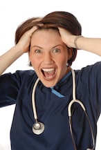 Stressed out doctor with hands on head representing the challenges of answering Pediatric Board Questions