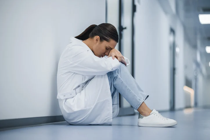 A Pediatric Board Forum by PBR – Join the PBR Facebook CREW! Pediatrician overwhelmed after failing the pediatric boards, illustrating the emotional weight that sparks the need for a structured recovery plan and smarter study strategy